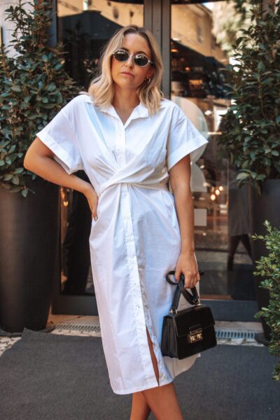 Vestido Ourique Branco é um modelo leve e elegante. Vestido branco midi estilo camiseiro. Vestido confortável e versátil.